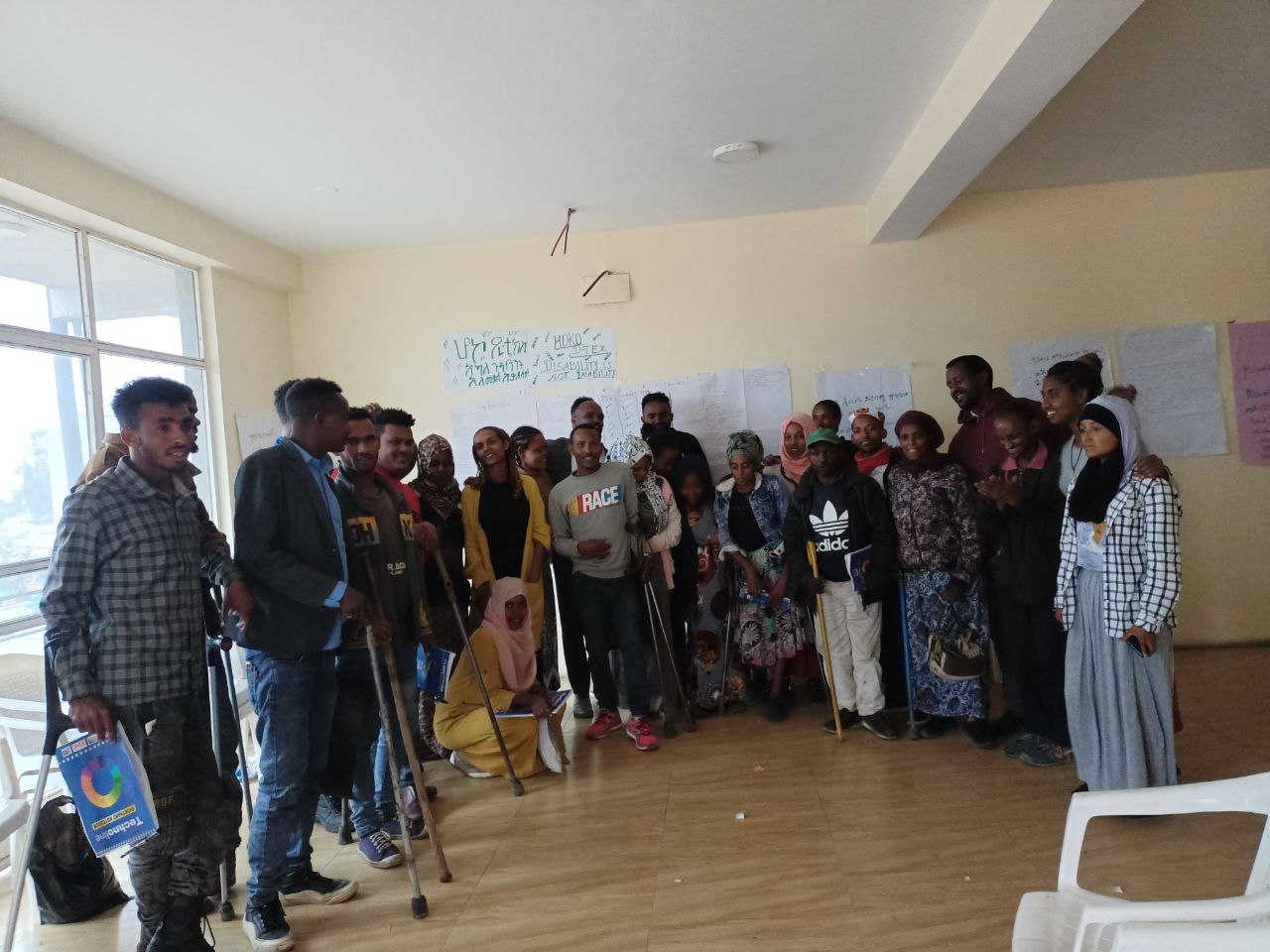 Group photo of PWD trainees in training room